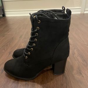 Black heeled lace-up boots
